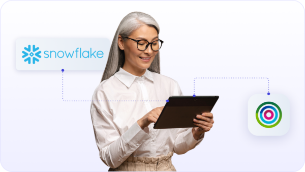 Woman working on iPad with Dotdigital and Snowflake integration to help